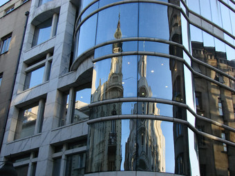 the "Progres" building, built 1993-1994, reflects conjunction of old and new