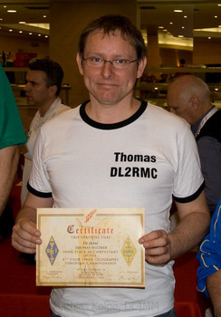 Thomas, DL2RMC, with his certificate